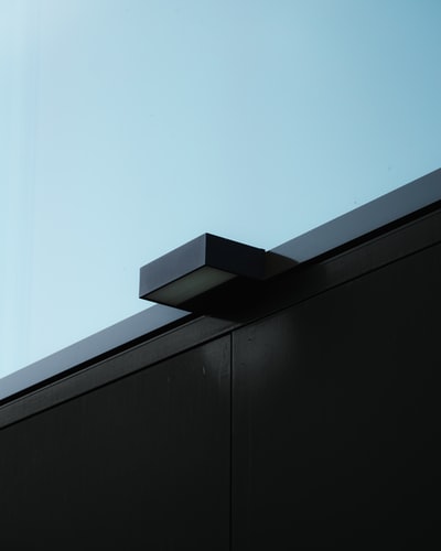 black wooden wall under blue sky